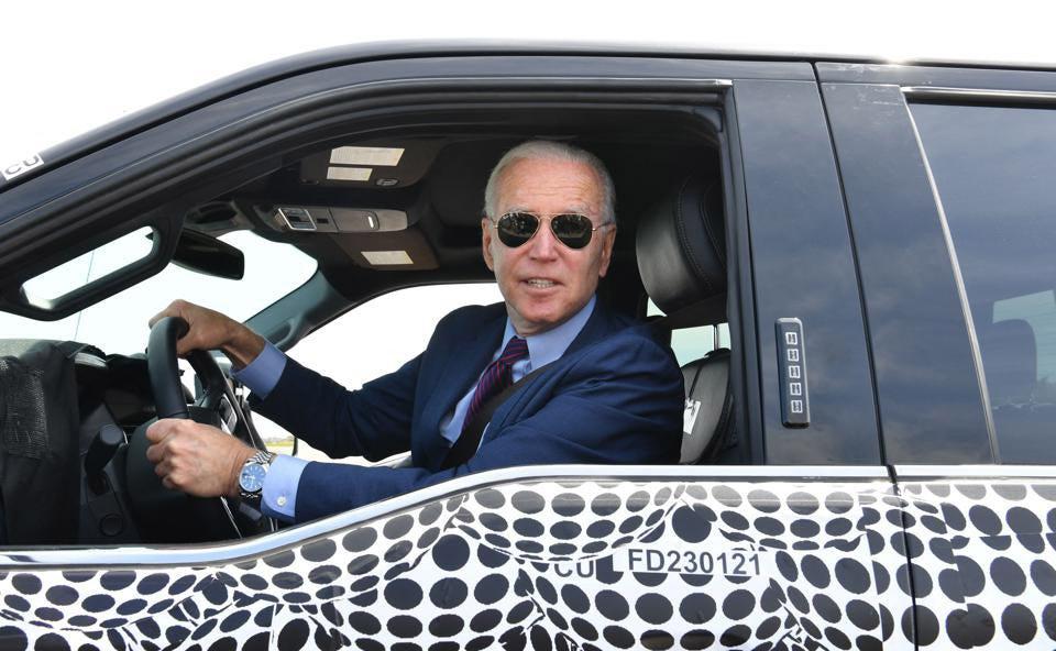 Cybercab Robotaxi EV sales have doubled. Is a ‘tidal wave’ coming? biden-ford-f-150-getty